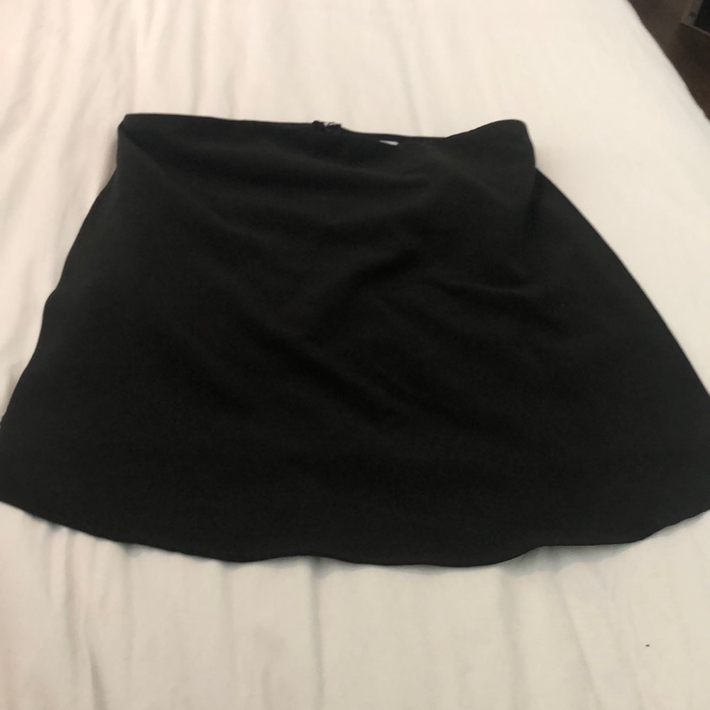 Tobi size small, open slit strapless black top